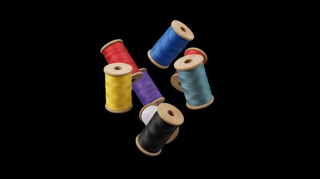 A collection of vibrant wooden thread spools in red, blue, yellow, purple, black, and light blue float and rotate slowly in mid-air against a solid black backdrop. This 3D animated asset is perfect fo