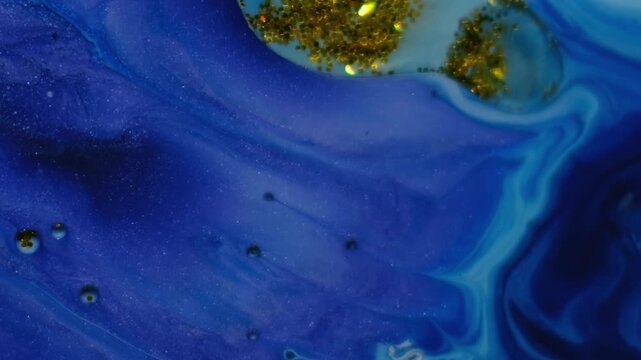 Paint gel water. Sparkling ink. Oil circle golden glitter drop floating blue marble acrylic stream. Shimmering liquid blur background.