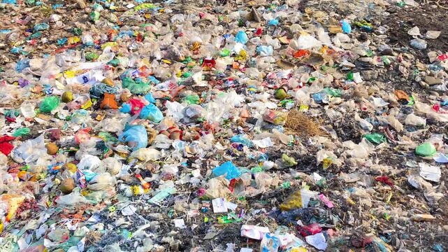 Garbage dump overflowing with plastic waste environmental pollution concept.