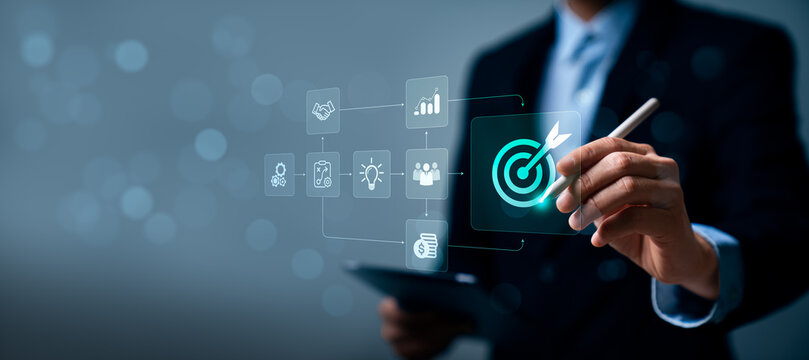 Business strategy targeting concept with professional using digital target interface showing workflow planning teamwork innovation financial growth process and goal achievement