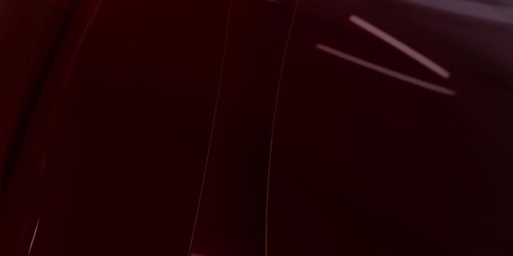Abstract dark red circle tunnel shape with flowing layers and light reflections in a digital space