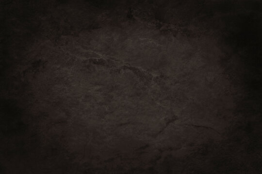 Dark brown slate texture in natural pattern with high resolution for background and design art work. Brown stone wall.