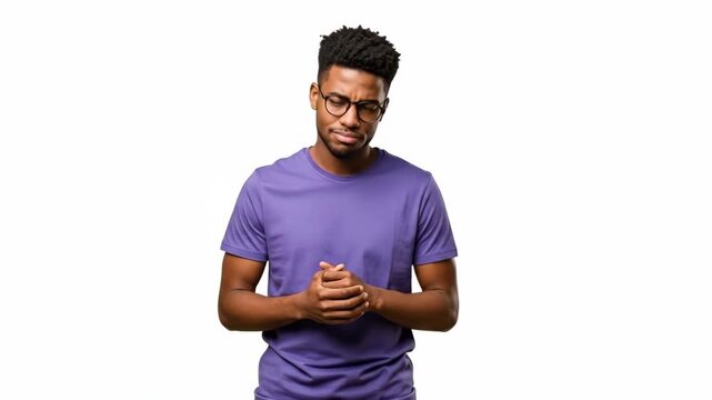 A contemplative young man in a purple shirt looking away in deep thought