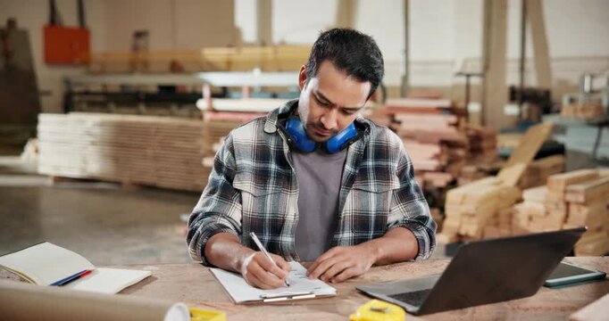 Writing, carpenter and laptop with man in workshop for woodworking inventory, research and artisan. Furniture checklist, quality assurance and clipboard with person in factory for production