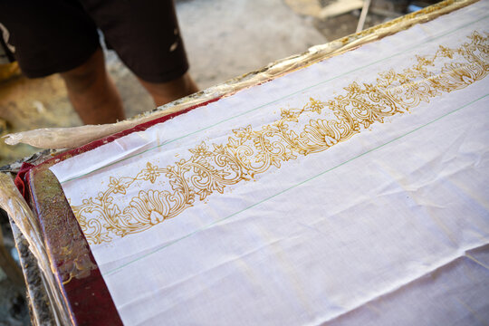 Artisan Printing Geometric Batik Pattern on White Cloth