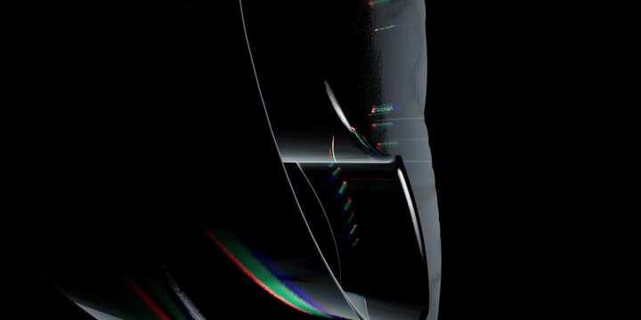 Abstract dark metallic curved shape with colorful light reflections on a smooth black background