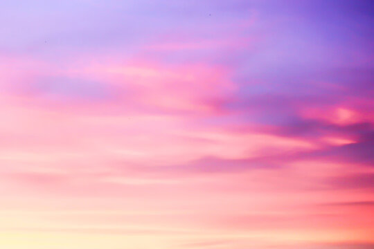 Pink and Purple Sunset Sky with Soft Clouds Background