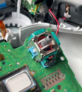 Cleaning and repairing game controller joystick, gaming maintenance and electronics repair concept