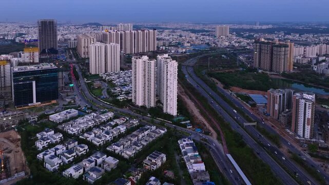 LISA GROVES villas with Jayabheri The Peak, Ramky One Astra apartments and outer ring road at Financial District, nanakramguda, hyderabad, telangana, india. day time, push in shot, drone shot, 4k.