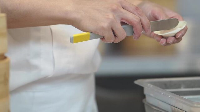 Cooking dumplings in a kitchen with steam baskets