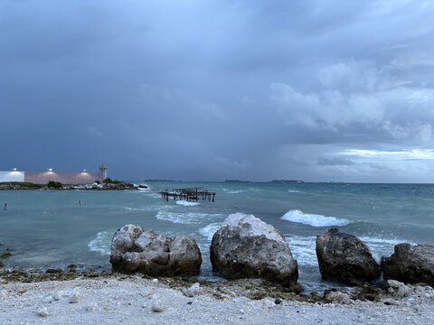 Cloudy sky on a paradise tropical beach rock pier in Maldives