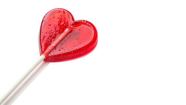 Bright red heart shaped glossy lollipop candy on a stick isolated on transparent background cut out