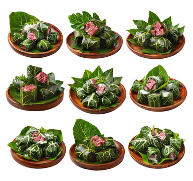 Lu Pulu corned beef cooked in coconut milk in taro leaves in wooden bowl, isolated on white background, concept of Polynesian food