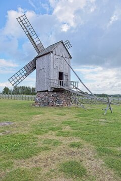 Historic wooden post mill (pukktuulik) located at Angla Windmill Park located on Saaremaa Island in Estonia, Europe.
