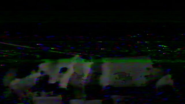 Damaged vhs tape transitioning with static noise, glitches, and color distortion. Retro analog video effect with rolling flicker and bad signal