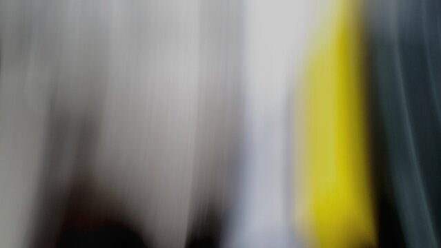 Abstract Motion Blur Background with Vertical Gray Black Yellow Streaks, Dynamic Camera Movement, Speed Effect, Modern Artistic Texture, Soft Gradient, Minimal Design, Contemporary Wallpaper, Creative