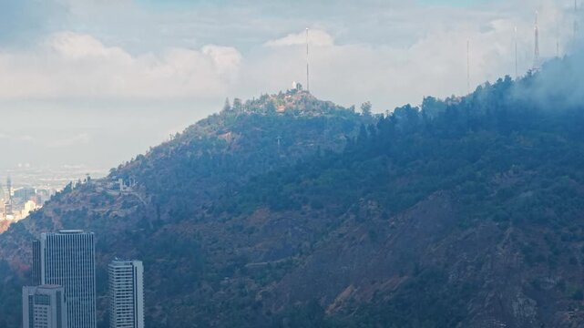 Telephoto aerial view of San Crist&oacute;bal Hill on a cloudy day, Santiago, Chile
