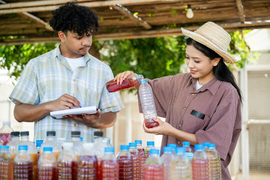 Agricultural students produce organic fertilizers, natural gardener compost tea prepared for agriculture with documenting biofertilizer production