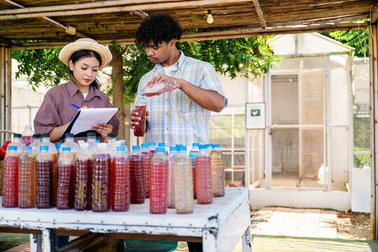 Agricultural students produce organic fertilizers, natural gardener compost tea prepared for agriculture with documenting biofertilizer production, With Copy Space