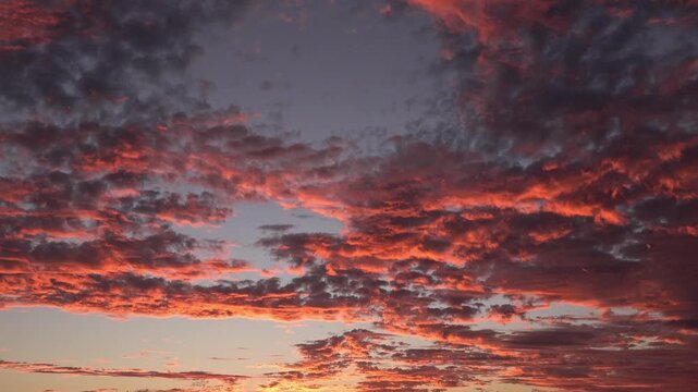 Dramatic Fiery Sunset Sky with Glowing Orange Clouds and Vibrant Cloudscape at Dusk Nature Landscape