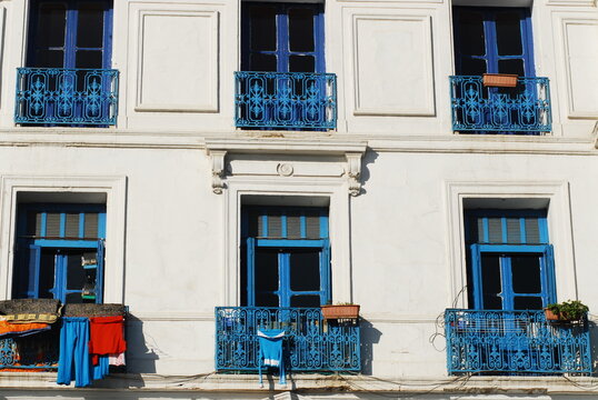 Algeria, Algiers, clothes hanging on clothesline for drying in the balcony of residential building