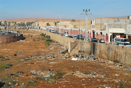 Algeria, Ghardaia, vehicles on road with telephone poles and power lines