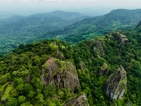 erial view of the ancient volcanic rock formations of Gunung Api Purba Nglanggeran in Yogyakarta, Indonesia.