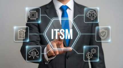 Fototapeta premium Businessman touching ITSM virtual interface for IT service management