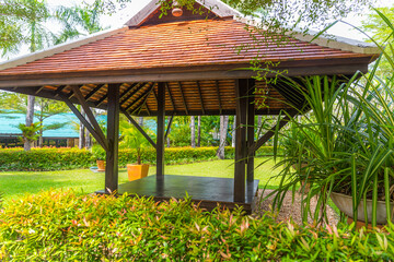 Obraz premium beautiful wooden gazebo in tropical nature in Thailand