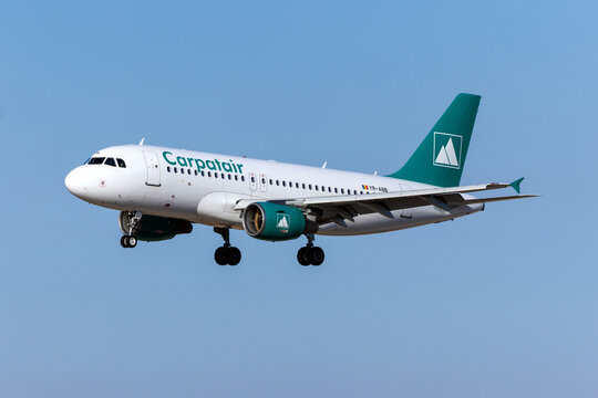 Luqa, Malta - July 5, 2026: Carpatair Airbus A319-112 (Reg.: YR-ABB) landing runway 31, arriving from London Stansted airport as flight V3496.