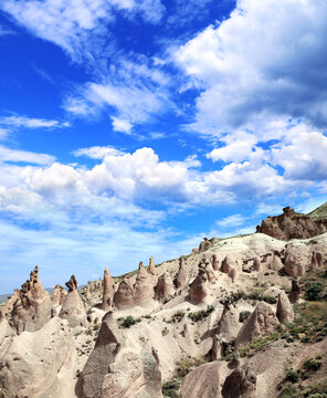 Beautiful landscape with Symbol of Cappadocia - Fairy Chimney or Multihead stone mushrooms in Pasabag Valley, Anatolia, Turkey. Topic of vacation, travel, trip abroad on vacation, cruises and tours