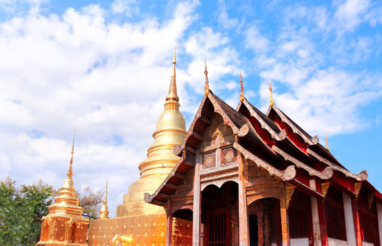 Golden stupa and wooden pavilion in Wat Chedi Luang Temple complex, Chiang Mai, Thailand. Wat Chedi Luang is a Buddhist temple in historic center of Chiang Mai. Topic of vacation, travel, trip, tour