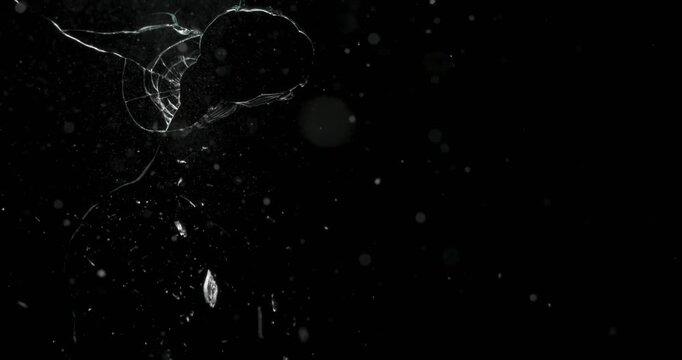 This visually striking video showcases the unpredictable nature of glass breakage against a black background, making it ideal for motion graphics, artistic expression, and abstract design