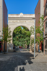 Fototapeta premium La Maquinista Terrestre y Maritima Historic Arch, Old Factory Entrance in Barceloneta Neighborhood, Urban Architecture, Barcelona