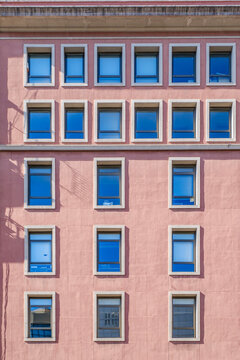 Barcelona, Symmetric Windows on Pink Building Facade, Modern Geometric Architecture, Minimalist Urban Apartment Exterior