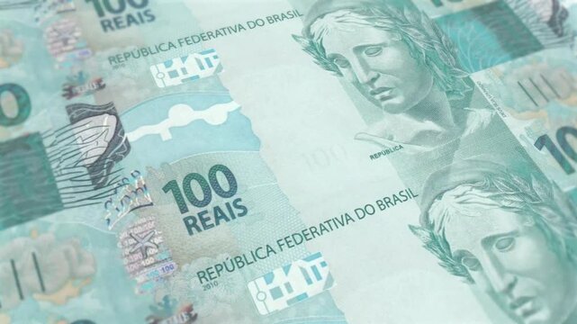 Brazilian 100 Real banknote packs falling loop. Brazilian money note fall. 3D seamless looped isolated abstract concept of economy, finance, crisis, success and banking on Blue screen
