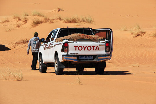 Chinguetti, Mauritania - 11 Jan 2022: Cars on sand dunes of Sahara Desert , Mauritania, West Africa