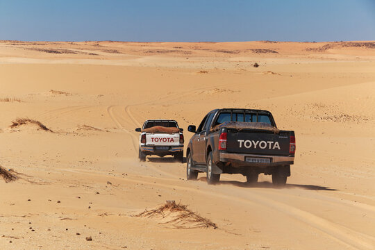 Chinguetti, Mauritania - 11 Jan 2022: Cars on sand dunes of Sahara Desert , Mauritania, West Africa