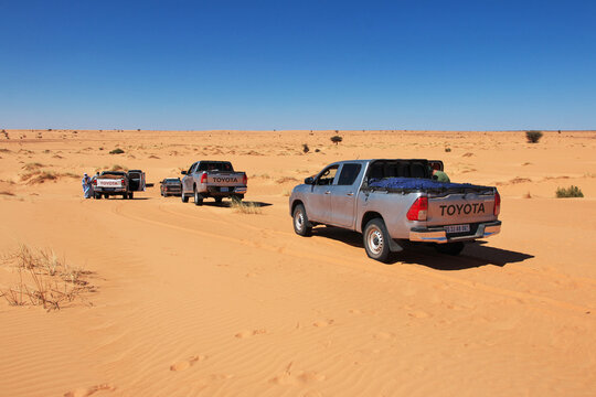 Chinguetti, Mauritania - 11 Jan 2022: Cars on sand dunes of Sahara Desert , Mauritania, West Africa
