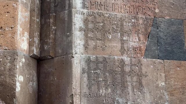 religious church and monastery of Christian cross sign of Armenian in Armenia Yerevan stone carving inscription script alphabet ornament relief architecture heritage historic ancient cultural tourism