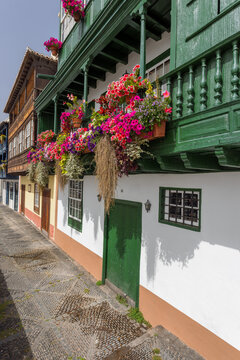 The Balcones de la Avenida Maritima, town houses with wooden balconies decorated with colourful flowers in Santa Cruz de La Palma, the capital of La Palma, Canary Islands, Spain.