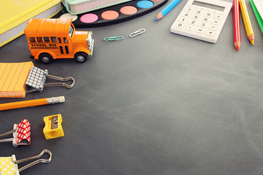 Back to school concept over classroom blackboard. Top view