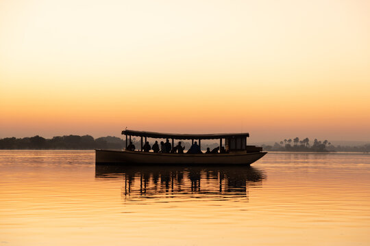 vintage boat on the Zambezi River at sunrise, Zambia, Africa