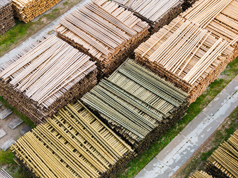 Aerial view of stacked timber logs in a lumber yard representing sustainable forestry operations in Latvia.