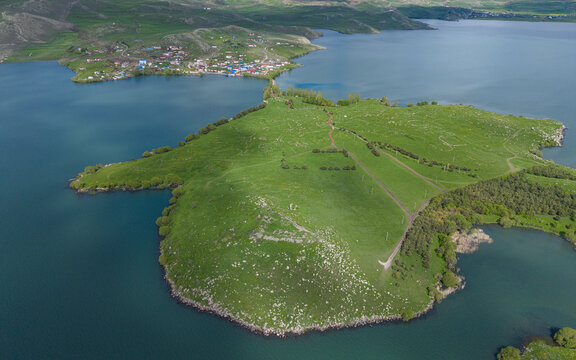 Akcakale Island and Historic Castle Ruins on Cildir Lake in Ardahan Province Turkey Eastern Anatolia Drone View
