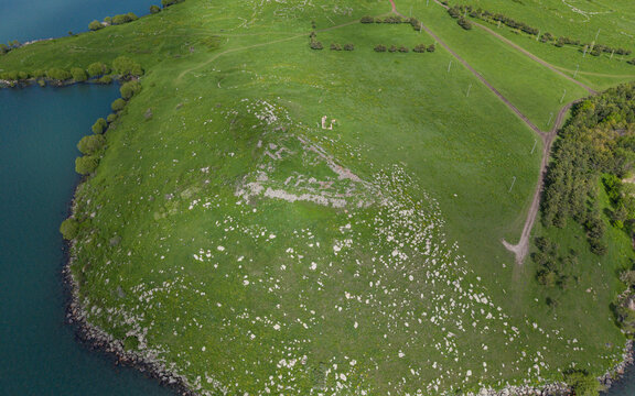 Akcakale Island and Historic Castle Ruins on Cildir Lake in Ardahan Province Turkey Eastern Anatolia Drone View