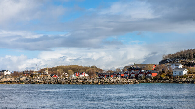 Typical red wooden houses on an island close to Hammerfest in Norway
