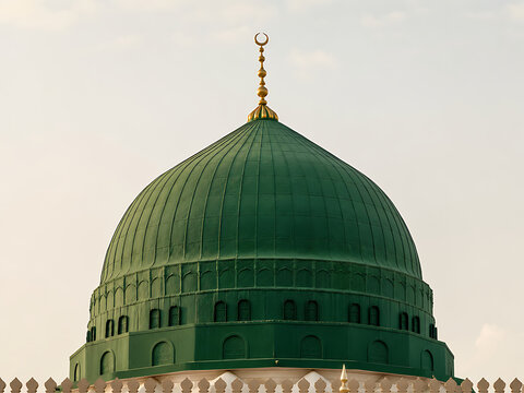 Green dome of holy Islamic mosque in soft daylight for spiritual background

