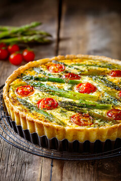Homemade Asparagus and Tomato Quiche Fresh from the Oven. AI generative.