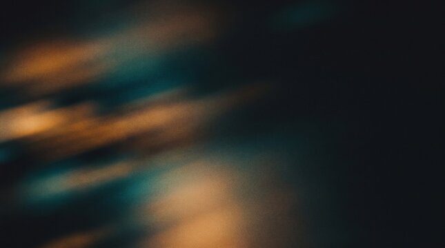 Abstract dark moody background with amber light leaks and grainy film texture